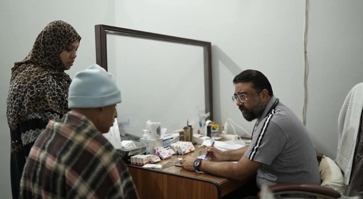Doctor consulting patients in the PEBS Hospital Cardiac and Diabetes Unit clinic
