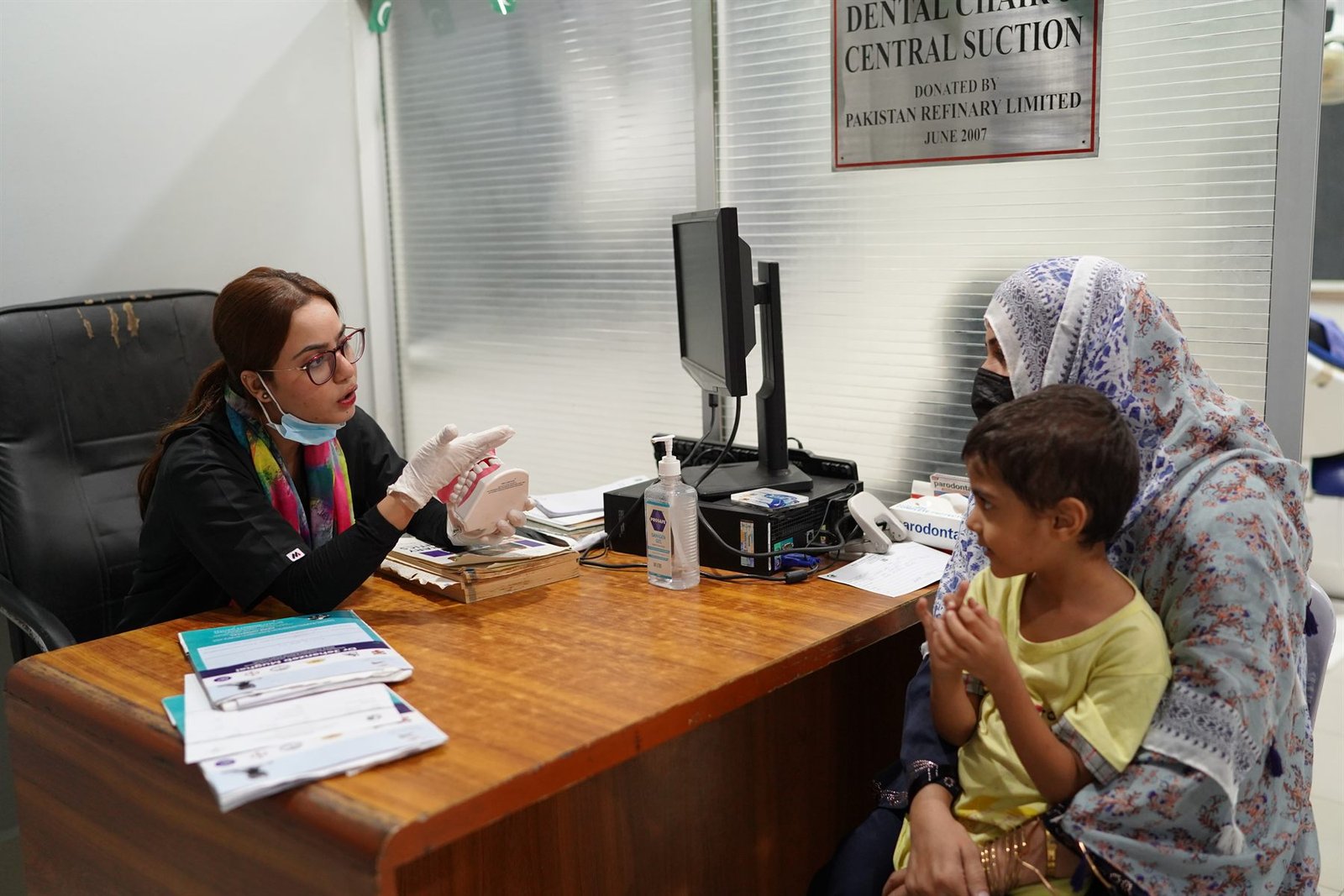 Dental OPD consultation with a mother and child at PEBS Hospital