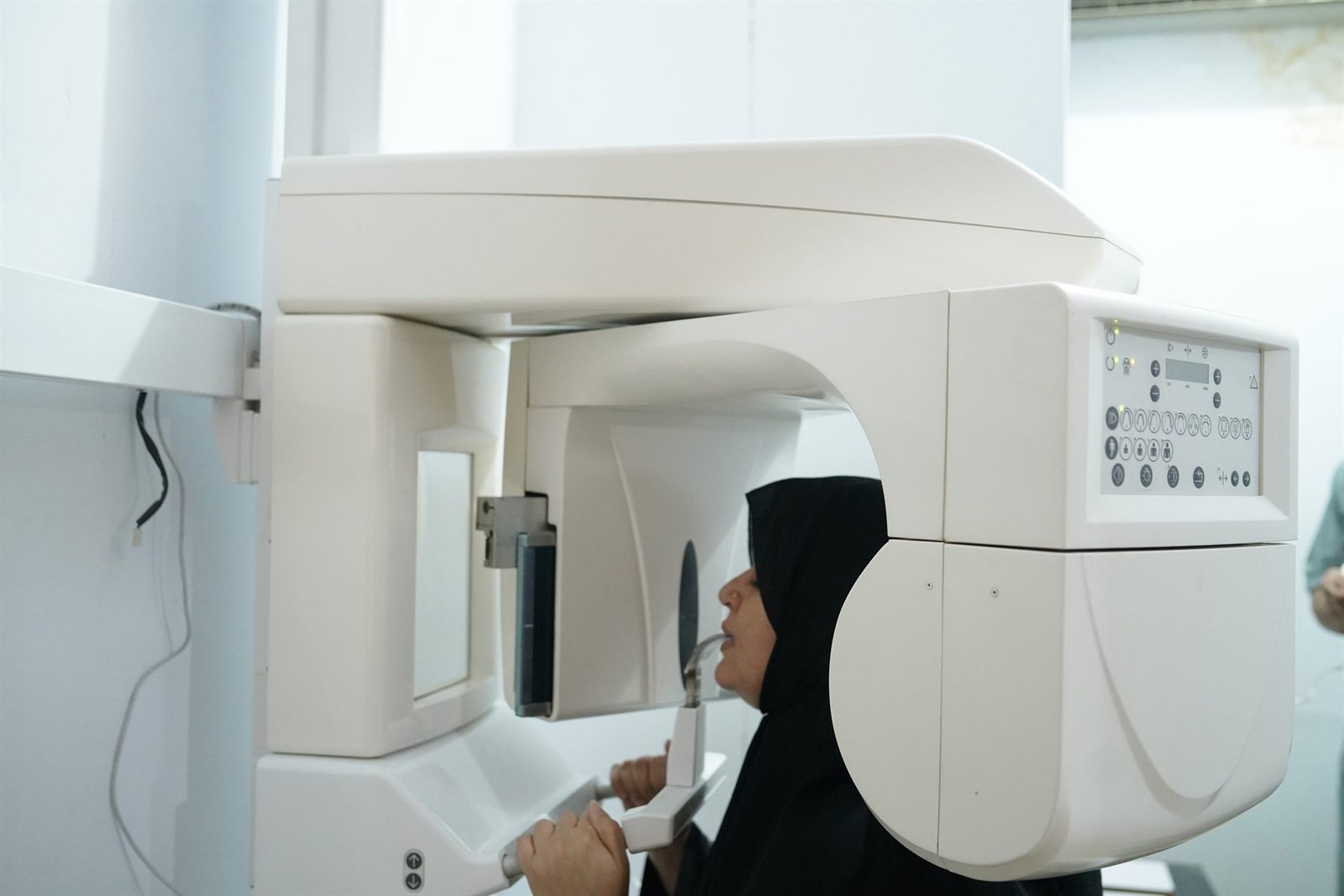 Patient undergoing an OPG panoramic dental X-ray at PEBS Hospital