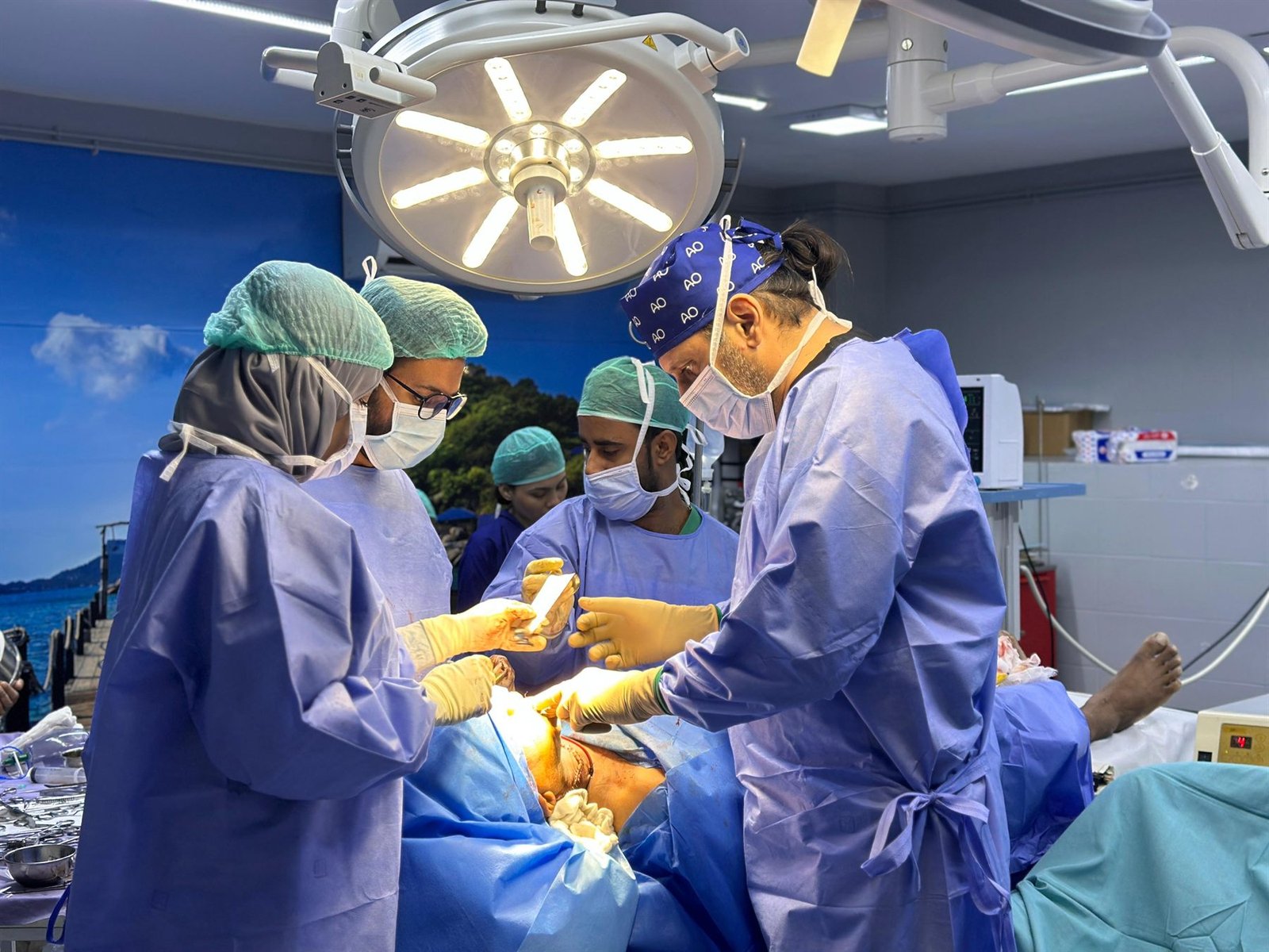 Surgical team performing an operation in the PEBS Hospital operation theatre