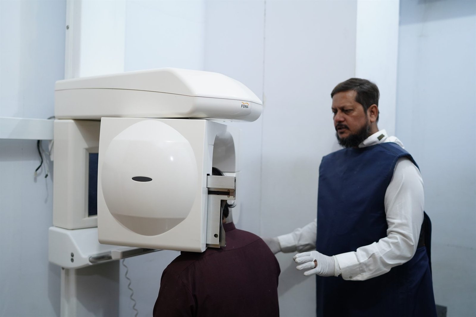 Patient being positioned at the OPG panoramic X-ray machine in the PEBS Hospital Radiology Unit