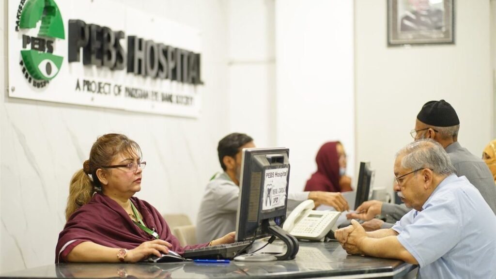 Patients at the PEBS Hospital reception desk