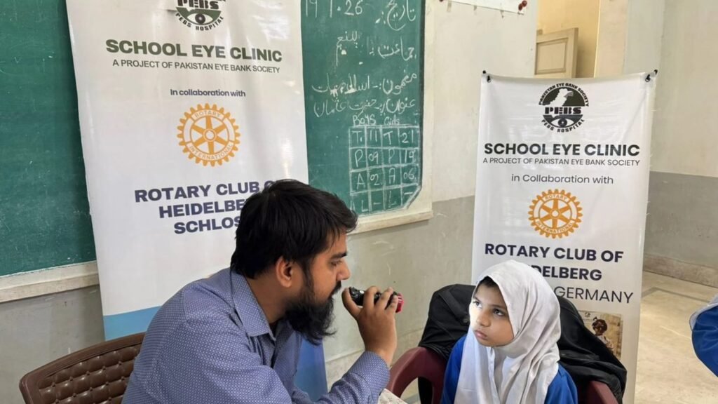 Schoolgirls queueing for eye screening, PEBS School Eye Clinic