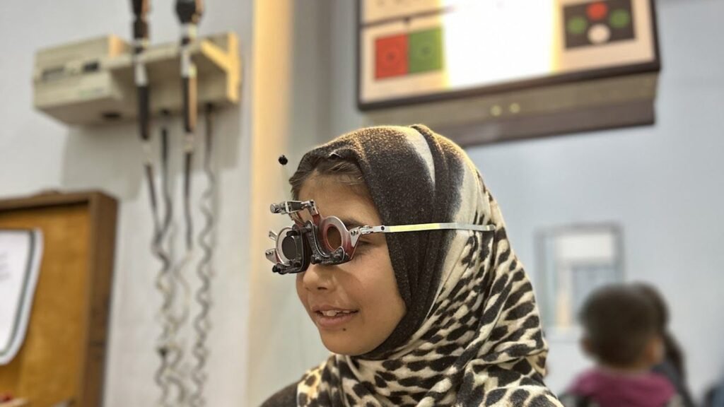 A schoolgirl in trial frames, PEBS School Eye Clinic